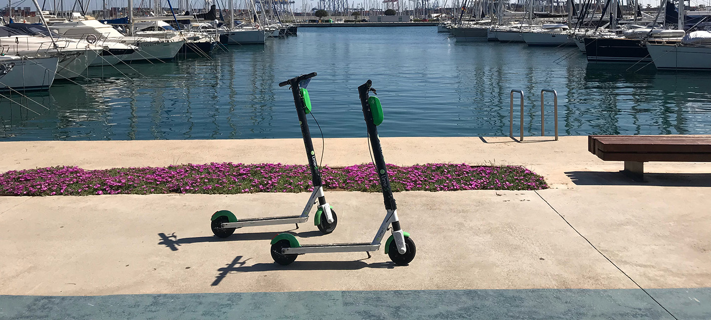 A city view filled with rental scooters